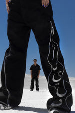 Load image into Gallery viewer, The Asili duo zipper jeans is a black denim jeans
