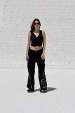 Load image into Gallery viewer, The Asili duo zipper jeans is a black denim jeans
