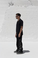 Load image into Gallery viewer, The Asili duo zipper jeans is a black denim jeans
