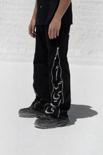 Load image into Gallery viewer, The Asili duo zipper jeans is a black denim jeans
