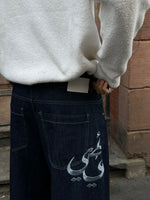 Load image into Gallery viewer, The Asili Mega baggy jeans in navy blue with silver embroidery
