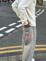 Load image into Gallery viewer, The Asili Mega baggy jeans in cloud grey with pink bubblegum embroidery
