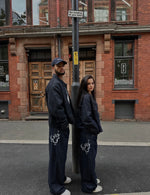 Load image into Gallery viewer, The Asili Mega baggy jeans in navy blue with silver embroidery
